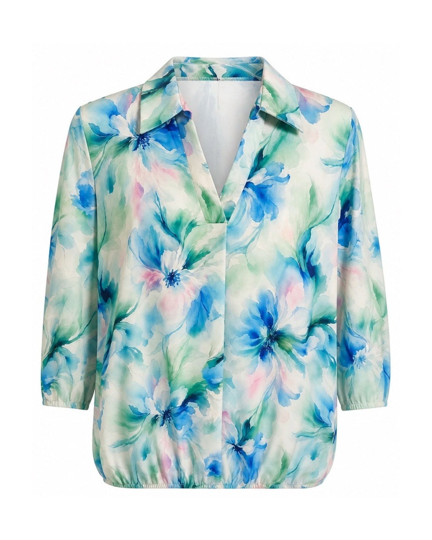 Groen blouson poloshirt met kobaltblauwe bloemen, verkrijgbaar bij Marijke Mode.