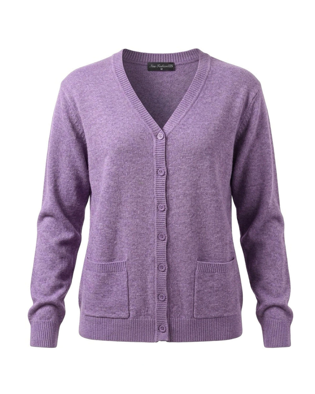 Damesvest met V-hals, knopen en zakjes in pastelkleuren, verkrijgbaar bij Marijke Mode.