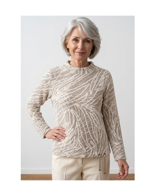 Gabrielle K. warme turtlenecktrui met streepdessin, glitterveter en sportieve mouwbies, verkrijgbaar bij Marijke Mode