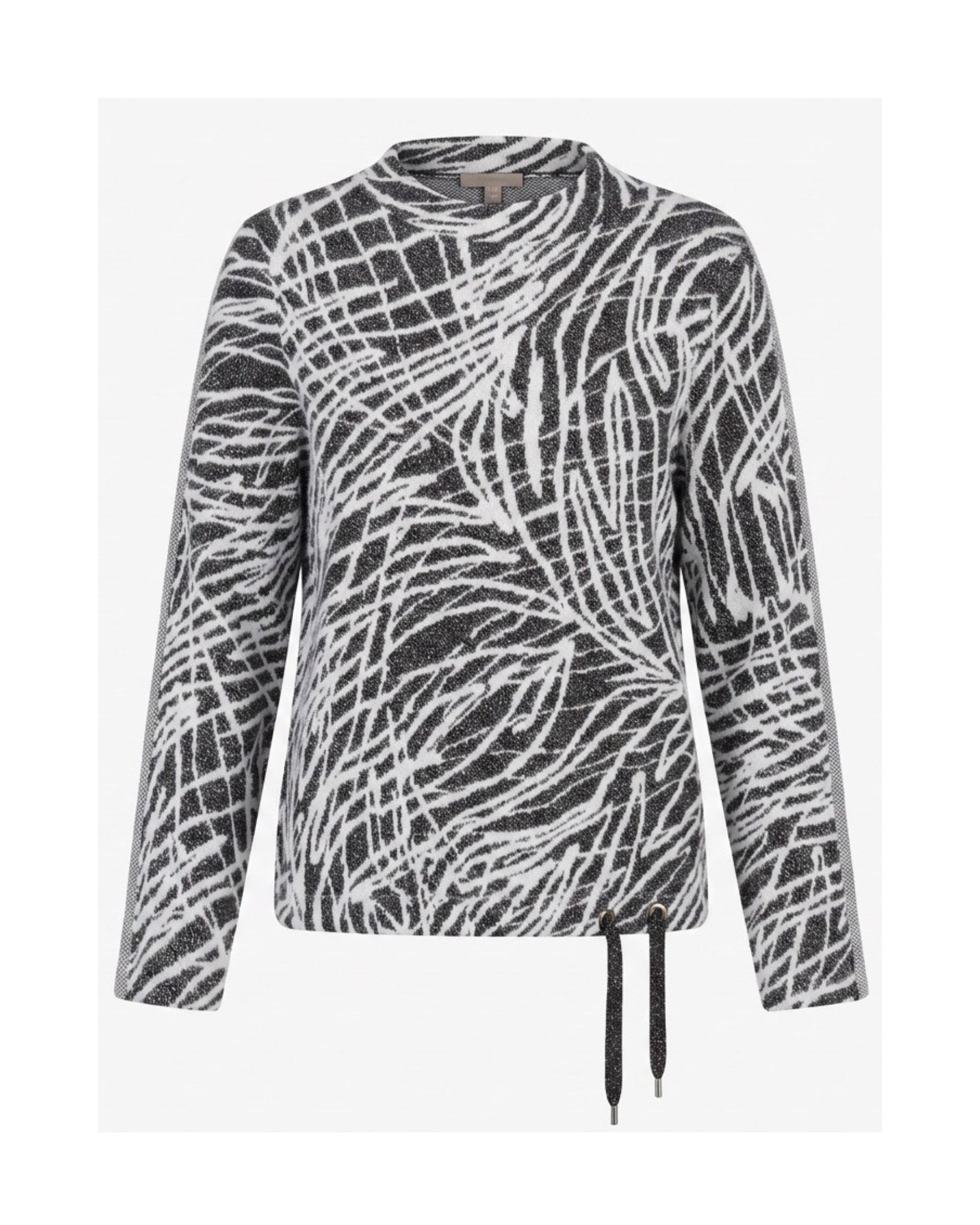 Gabrielle K. warme turtlenecktrui met streepdessin, glitterveter en sportieve mouwbies, verkrijgbaar bij Marijke Mode.