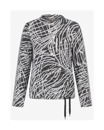 Gabrielle K. warme turtlenecktrui met streepdessin, glitterveter en sportieve mouwbies, verkrijgbaar bij Marijke Mode.