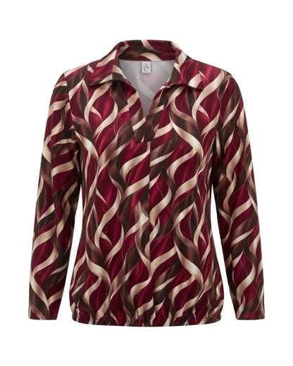 Blouson poloshirt met kraagje, bescheiden V-hals, lange mouwen en elastiek aan de onderkant.