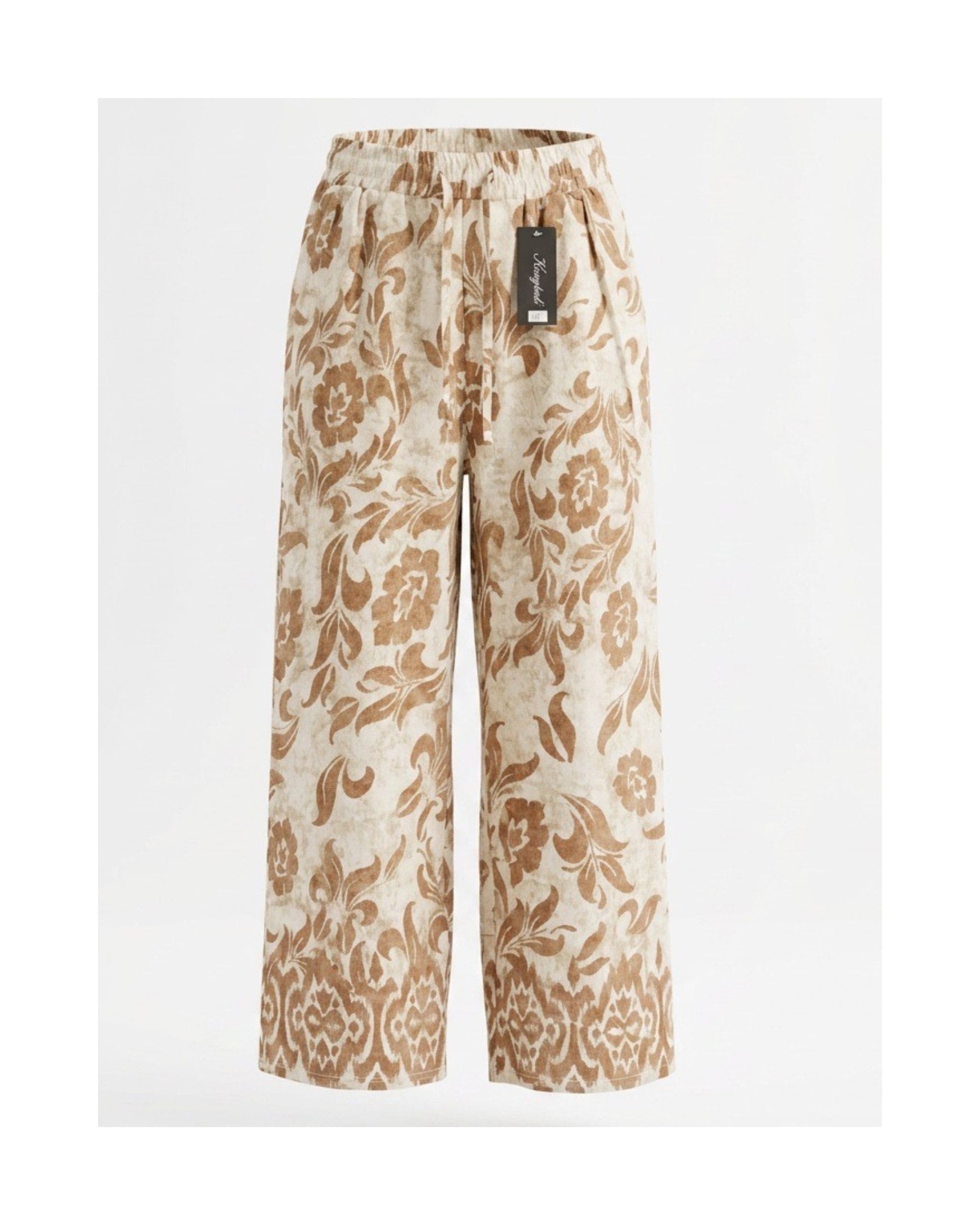 Zomerse bloemenprintbroek met elastische tailleband en steekzakken, verkrijgbaar bij Marijke Mode.